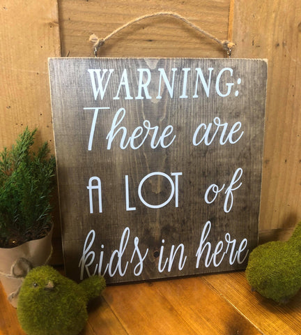 Warning:  There are a lot of kids in here wood sign