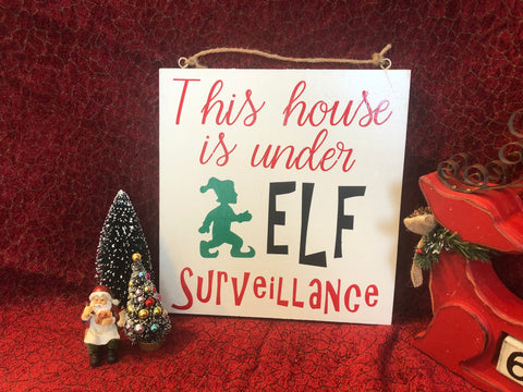 This house under Elf surveillance wood sign